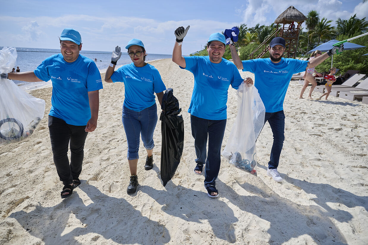 Destination Zero Waste Cancun - volunteers after a hard day of cleaning up the beach
